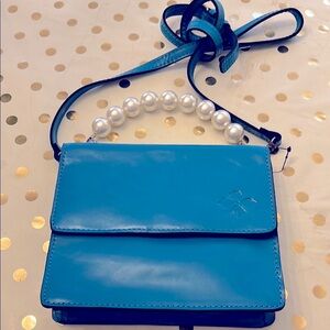 Sleek Blue Crossbody Bag with Pearl Accent by Patricia Nash